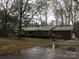 Charming brick home with a well-maintained lawn and lush landscaping at 235 John Rainey Rd, Salisbury, NC 28147