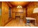 Wood paneled office with built-in cabinets, desk, and hardwood floors at 235 John Rainey Rd, Salisbury, NC 28147