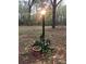 Outdoor light post surrounded by lush plants and decorative pots at 235 John Rainey Rd, Salisbury, NC 28147