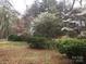 Lawn of yard with lush trees and bushes, offering a serene outdoor setting at 235 John Rainey Rd, Salisbury, NC 28147