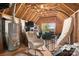 Unfinished attic space featuring wood framing, a window, a water heater and plenty of storage potential at 2363 Shanklin S Ln, Denver, NC 28037