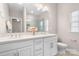 Bathroom with double sink vanity, glass-enclosed shower, and neutral color palette at 2363 Shanklin S Ln, Denver, NC 28037