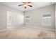 Spacious bedroom with neutral carpet, ample natural light, and en-suite bathroom at 2363 Shanklin S Ln, Denver, NC 28037