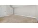 Spacious bedroom with neutral carpet, with access to other rooms in the house at 2363 Shanklin S Ln, Denver, NC 28037