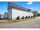 A lovely two-story home with a garage, manicured lawn, and beautiful landscaping at 2363 Shanklin S Ln, Denver, NC 28037