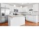 Modern kitchen with white cabinetry, subway tile backsplash, stainless steel appliances, and hardwood floors at 2363 Shanklin S Ln, Denver, NC 28037