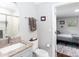 Bathroom featuring a toilet and granite vanity that connects to a bedroom at 2408 Dora Dr, Charlotte, NC 28215