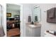 Granite vanity in a bathroom that is connected to a cozy home office at 2408 Dora Dr, Charlotte, NC 28215