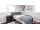 Cozy bedroom with a comfortable bed, a bedside table, and a light-filled window at 2408 Dora Dr, Charlotte, NC 28215