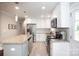 Bright and spacious kitchen featuring stainless steel appliances and a large center island at 2408 Dora Dr, Charlotte, NC 28215