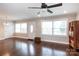 Open living room featuring hardwood floors, neutral walls, and a bright front entrance at 2408 Dora Dr, Charlotte, NC 28215