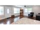 A view of the open living room, bathed in natural light from large windows at 2408 Dora Dr, Charlotte, NC 28215