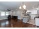 Open living room and kitchen with hardwood floors, stainless appliances, and granite countertops at 2408 Dora Dr, Charlotte, NC 28215