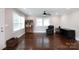 Spacious living room with dark hardwood floors, natural lighting, and modern fixtures at 2408 Dora Dr, Charlotte, NC 28215