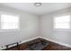 Bright workout space with natural light and dark wood floors includes weight bench at 2408 Dora Dr, Charlotte, NC 28215