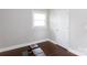 Workout room features dark wood floors and a weight bench with lots of light at 2408 Dora Dr, Charlotte, NC 28215