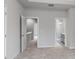 Clean bedroom with neutral tones, carpet flooring, and an open doorway to another area at 282 Gilead Rd, Huntersville, NC 28078