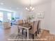 Cozy dining area featuring a stylish table, chairs and view into the bright living room at 282 Gilead Rd, Huntersville, NC 28078
