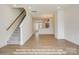 Inviting entryway showcasing a staircase with light walls and hardwood floors at 282 Gilead Rd, Huntersville, NC 28078