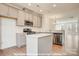 Well-lit kitchen featuring an island, stainless steel appliances, and an open floor plan at 282 Gilead Rd, Huntersville, NC 28078