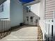 One car parking pad area with a rear door, gravel perimeter, and exterior home views at 282 Gilead Rd, Huntersville, NC 28078