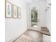 The light and airy entryway offers hooks, bench, rug, and a stylish door to the outside at 2508 Park Rose Ln # 17, Charlotte, NC 28204