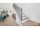 Modern staircase with hardwood steps and black metal railings, seamlessly connecting different levels of the home at 2508 Park Rose Ln # 17, Charlotte, NC 28204
