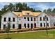 New construction home showing framing and Tyvek wrap, hinting at modern design at 282 Gilead Rd, Huntersville, NC 28078