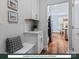 Drop zone off kitchen area with white cabinets and seating area, plus easy access to the main kitchen at 284 Gilead Rd, Huntersville, NC 28078