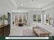 Oversized main bedroom with a sitting area featuring plenty of natural light and neutral carpet flooring at 284 Gilead Rd, Huntersville, NC 28078