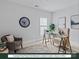 Office with a glass top desk, neutral walls, area rug, and natural light at 284 Gilead Rd, Huntersville, NC 28078