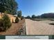 Paver street surrounded by greenery and trees, with overhead power lines at 284 Gilead Rd, Huntersville, NC 28078