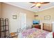 Well-lit bedroom has wood floors, a ceiling fan, and a mounted flat screen television at 304 Wintergreen Ct, Kings Mountain, NC 28086