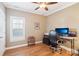 Cozy bedroom provides a window with shutters and ample space for an office area at 304 Wintergreen Ct, Kings Mountain, NC 28086