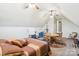 Spacious bonus room features exercise equipment, a table, and a comfortable sleeping area at 304 Wintergreen Ct, Kings Mountain, NC 28086