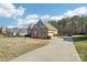 Single-story brick home with an attached garage and spacious driveway at 304 Wintergreen Ct, Kings Mountain, NC 28086