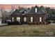Charming brick home featuring a manicured lawn and mature landscaping at 304 Wintergreen Ct, Kings Mountain, NC 28086
