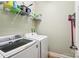 Efficient laundry room featuring modern, front-load washer and dryer, plus wire rack shelving for storage at 304 Wintergreen Ct, Kings Mountain, NC 28086