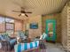 Relaxing screened-in patio with brick accents, comfortable seating, and a ceiling fan for optimal comfort at 304 Wintergreen Ct, Kings Mountain, NC 28086
