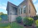 Brick home featuring a screened porch, well maintained landscaping, and convenient ground level access at 304 Wintergreen Ct, Kings Mountain, NC 28086