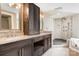 Bathroom featuring double vanity with granite countertop and a separate tiled shower at 3249 Ivey Creek Rd, Maiden, NC 28650