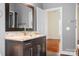 Bathroom featuring dark vanity with glass vessel sink and modern fixtures at 3249 Ivey Creek Rd, Maiden, NC 28650