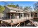 Stunning home exterior featuring a spacious deck and a seamless blend of wood and modern design elements at 3249 Ivey Creek Rd, Maiden, NC 28650