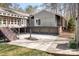 Rear exterior view featuring a patio, deck, yard and fountain, providing an inviting outdoor space for enjoyment at 3249 Ivey Creek Rd, Maiden, NC 28650