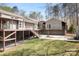 Spacious home featuring a large deck area, stairs to the yard, and potential for outdoor entertainment at 3249 Ivey Creek Rd, Maiden, NC 28650