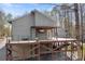 Beautiful elevated home exterior featuring a spacious deck, perfect for outdoor entertaining and enjoying nature views at 3249 Ivey Creek Rd, Maiden, NC 28650
