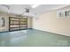 Spacious two-car garage with an abundance of light and epoxy floor at 3249 Ivey Creek Rd, Maiden, NC 28650