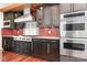Modern kitchen boasts stainless steel appliances, sleek cabinetry, and a stylish backsplash, perfect for cooking enthusiasts at 3249 Ivey Creek Rd, Maiden, NC 28650