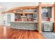 Open kitchen featuring granite countertops, stainless steel appliances, wine cooler, and stone accents at 3249 Ivey Creek Rd, Maiden, NC 28650