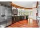 Modern kitchen featuring granite countertops, stainless steel appliances and a stone fireplace at 3249 Ivey Creek Rd, Maiden, NC 28650